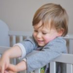 Little boy in his crib