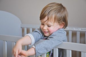 Little boy in his crib