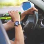 Man drinking and driving