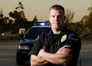 Cop in front of car