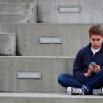 Teen boy texting