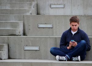 Teen boy texting