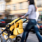 Woman pushing child in stroller