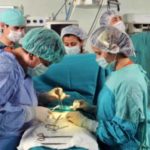 Surgeons performing operation