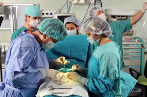 Surgeons performing operation