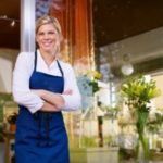 Flower shop girl in front of store