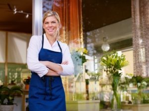 Flower shop girl in front of store