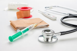 Syringe, bandaide and stethoscope