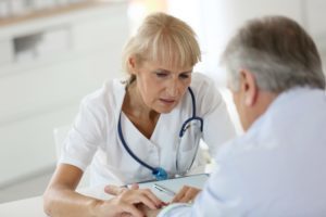 Woman giving patience diagnostic