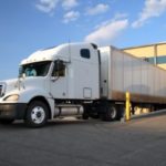 White semi truck at loading dock