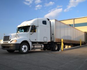 White semi truck at loading dock