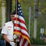 Veteran holding American flag
