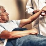 Older man getting his pulse taken