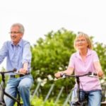 Older couple on bike