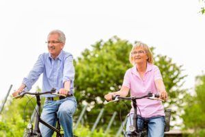 Older couple on bike