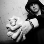 Handcuffed teenager