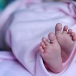 Newborn girl's feet