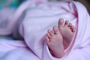 Newborn girl's feet
