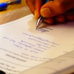 Person signing their name