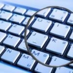 Magnifying glass on keyboard