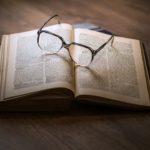 Glasses on book