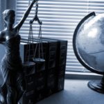 Scale of justice and globe