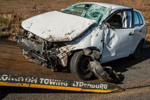 a deadly crashed car is being towed