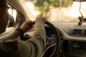 Backview of a driver driving a car