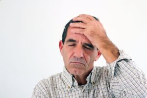 A senior man feels dizziness